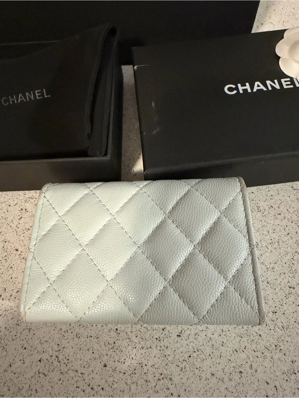 Chanel shiny caviar quilted crystal CC flap card holder light blue